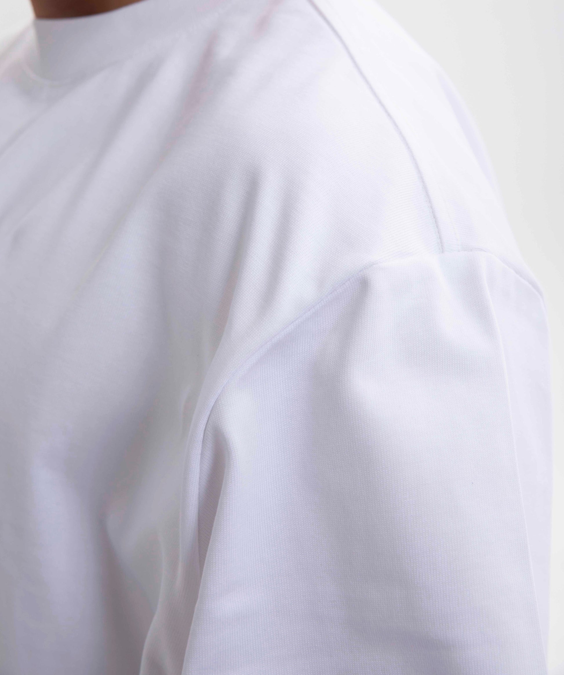 Close-up of a white shirt with a blurred background