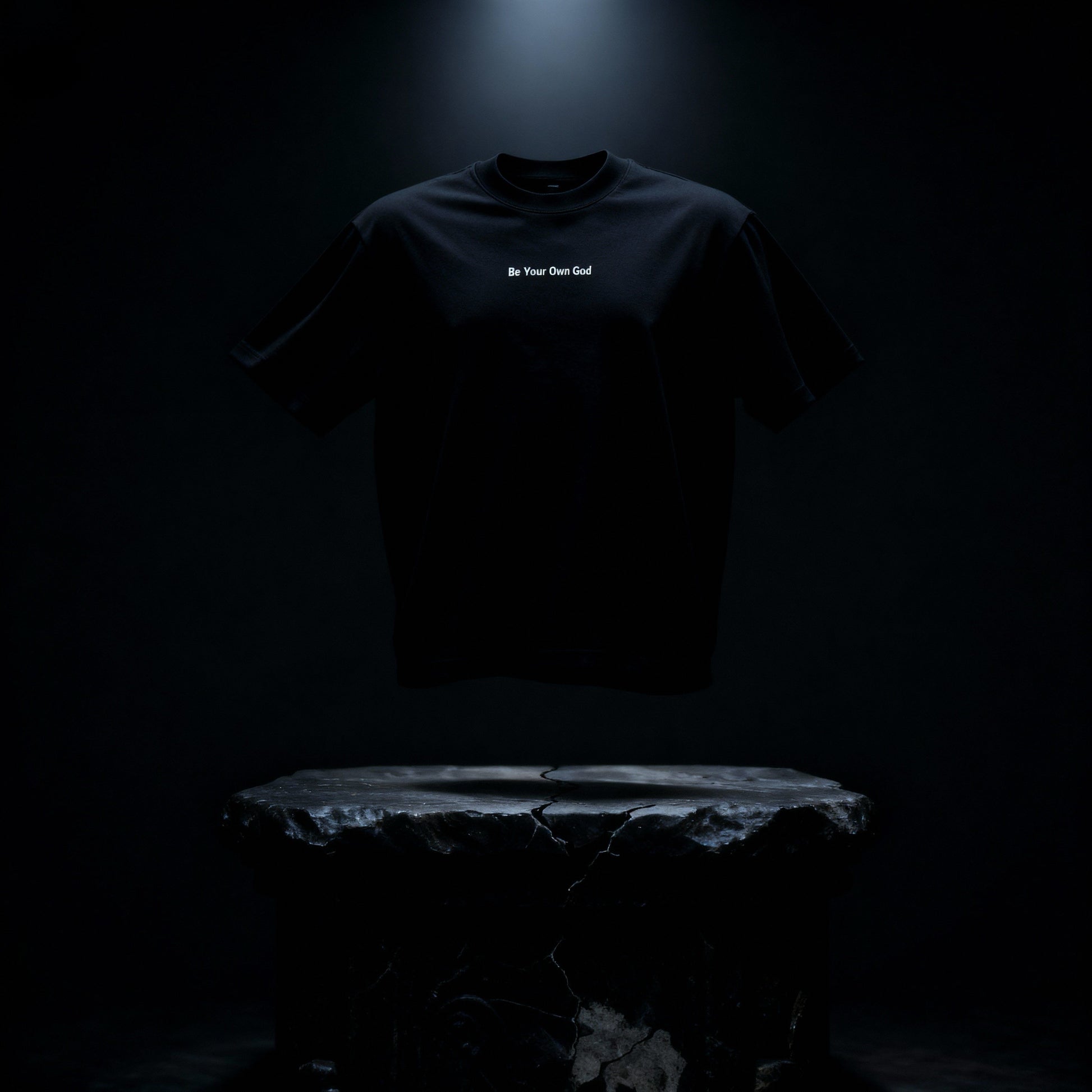 Black heavyweight tee photographed above stone altar in dark cinematic lighting 